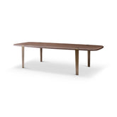 Side view of the Bohne Dining Table showing its soft curved edges and elegant brushed bronze legs, ideal for luxury interiors.